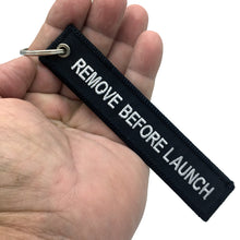Load image into Gallery viewer, Large 5 inch Black Artemis REMOVE BEFORE LAUNCH Luggage Tag zipper pull keychain NASA BL16-004 LKC-92